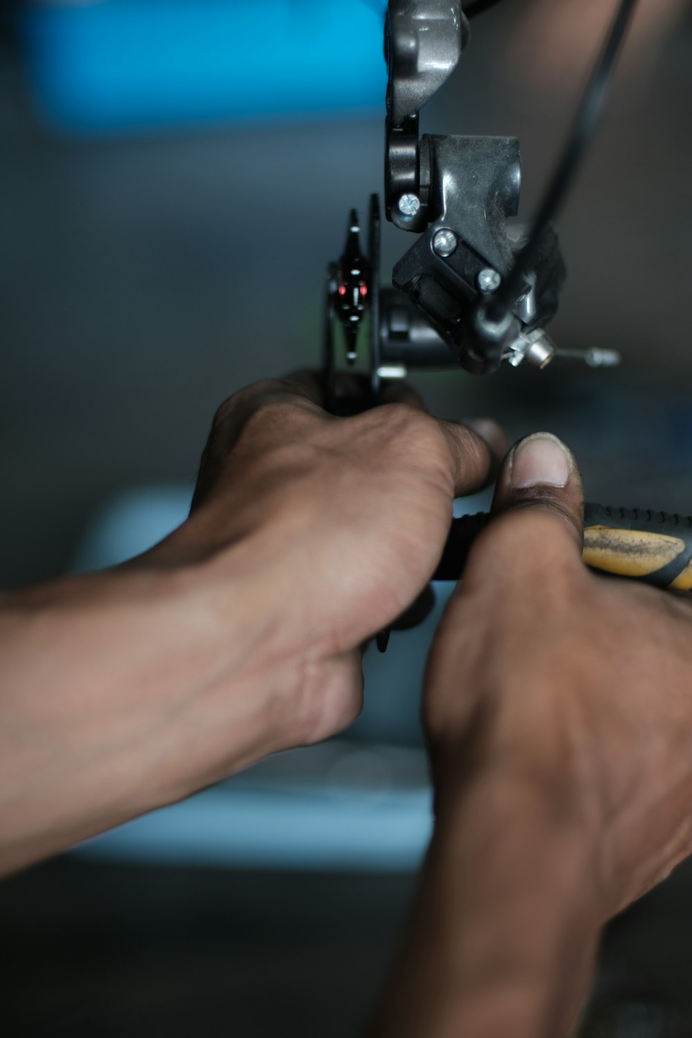 a close-up of a person using a sewing machine