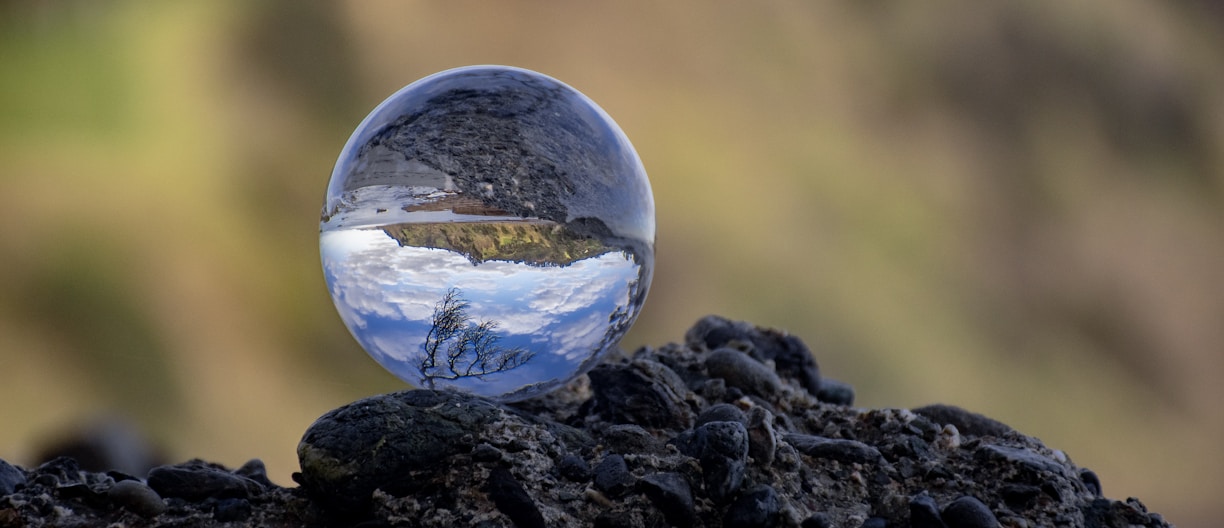 a glass sphere on a rock