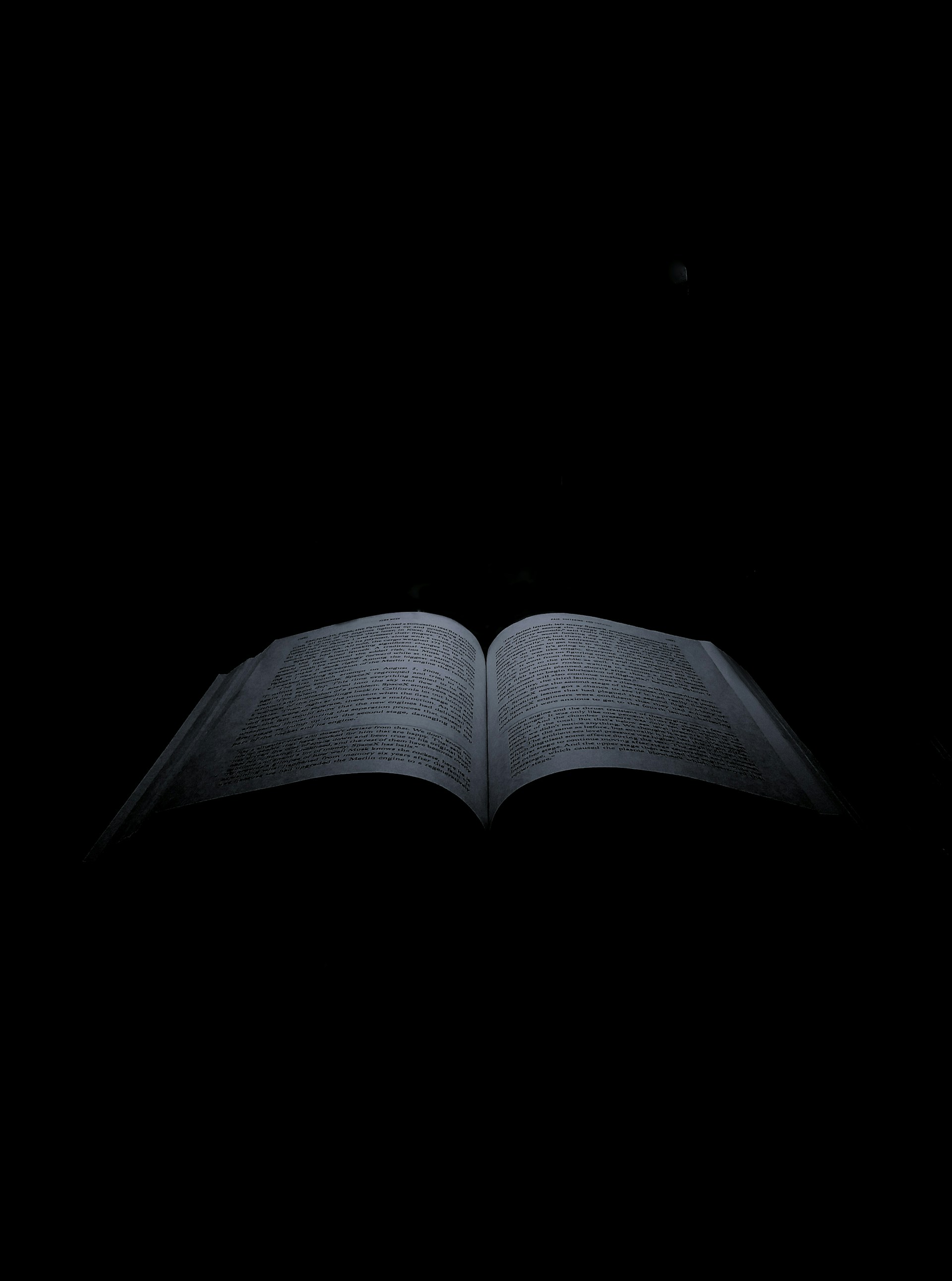 a book open with a black background