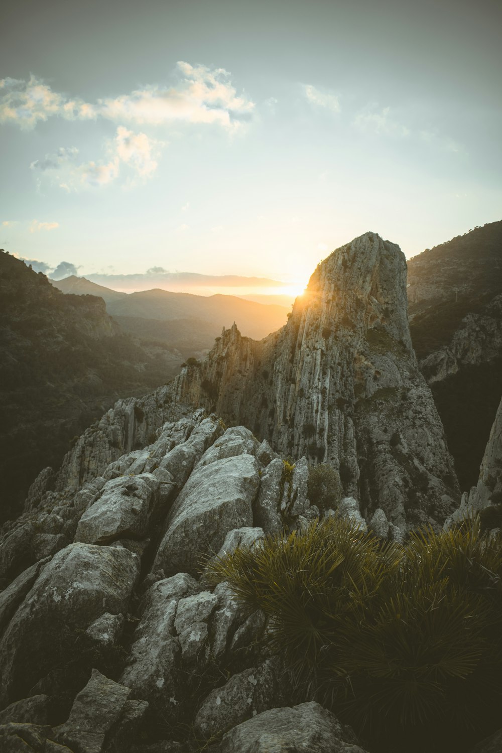 a rocky mountain with a sunset