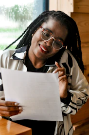 a person holding a paper