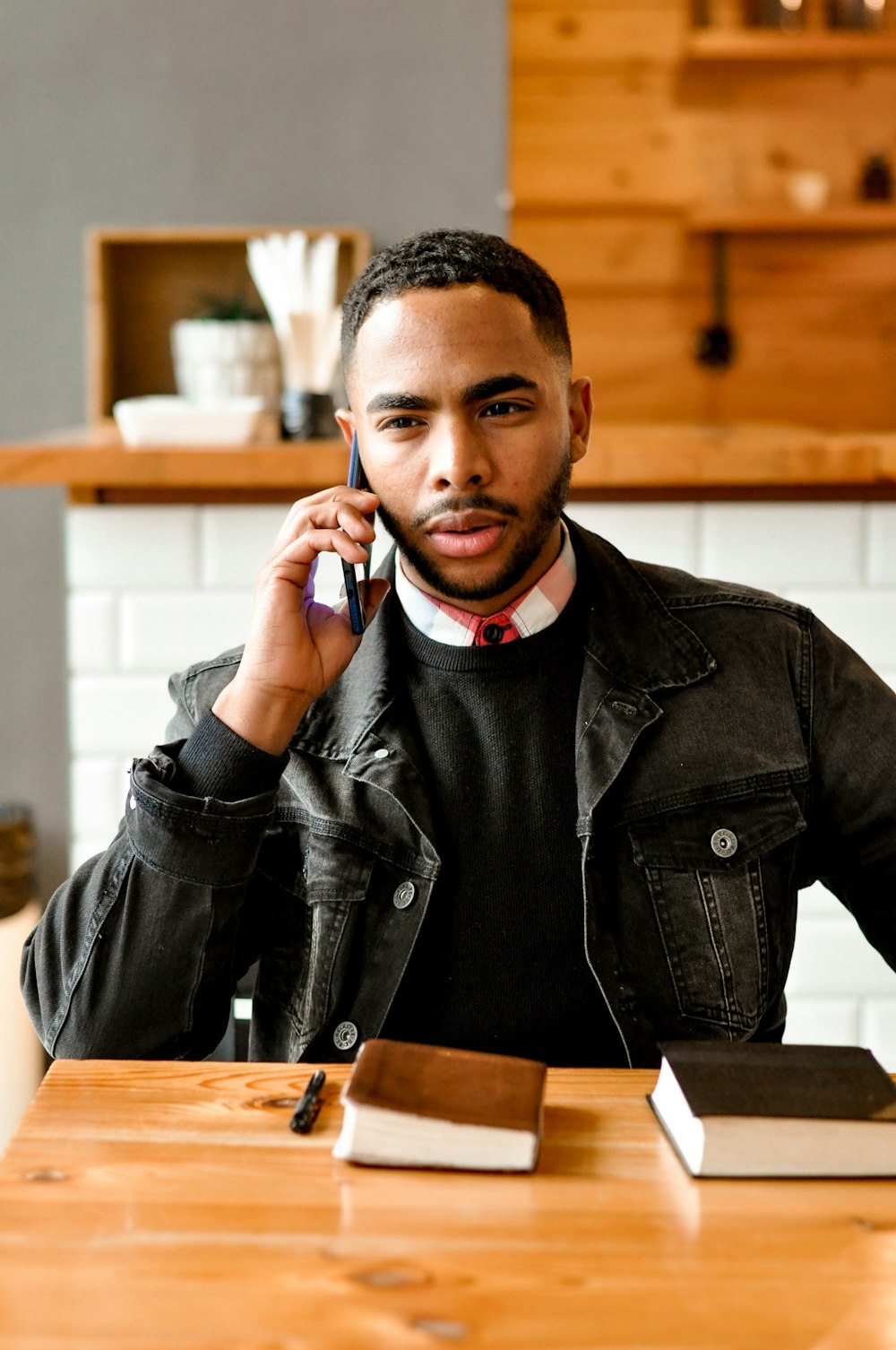 a man holding a phone to his ear