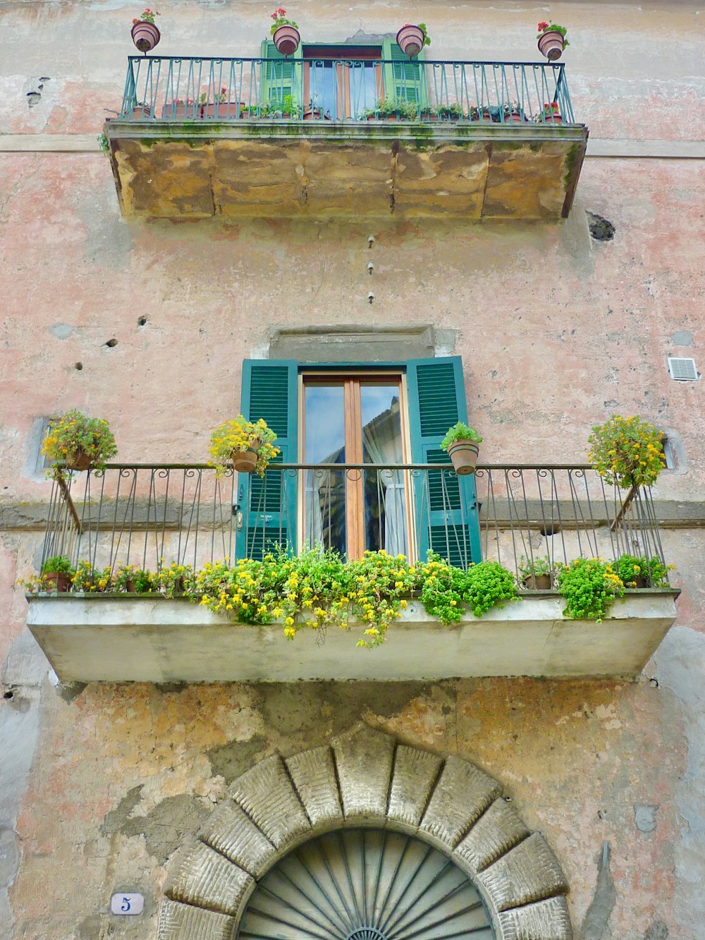 a balcony with flowers on it