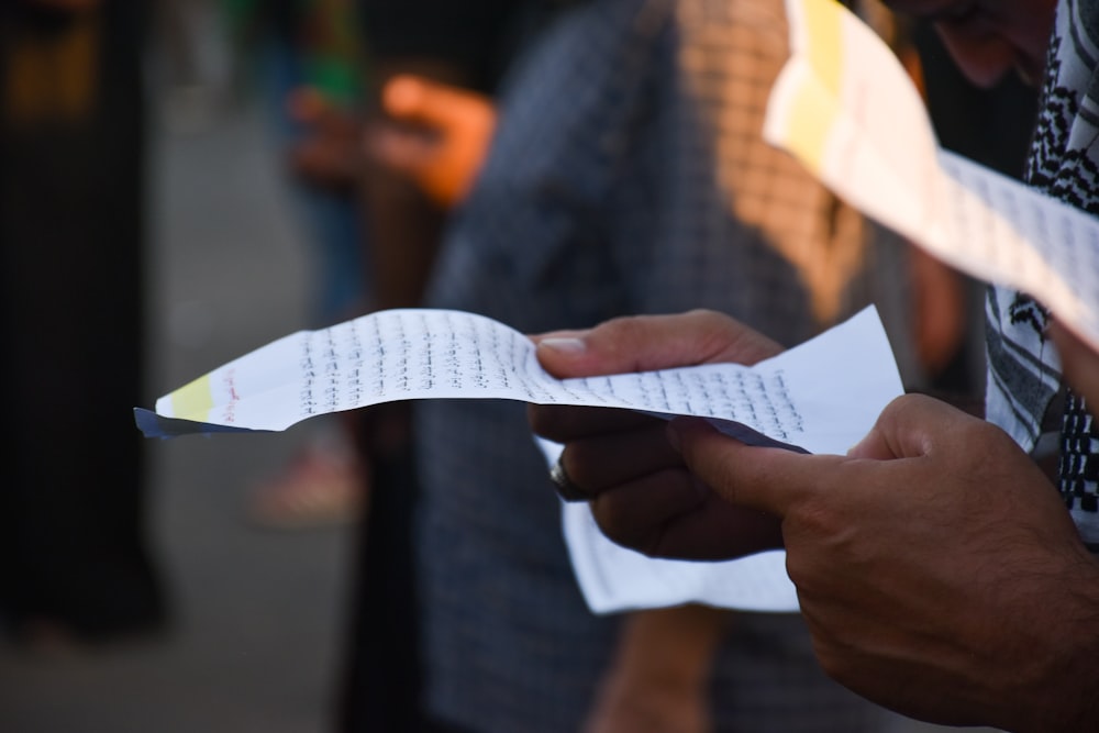 a person holding a piece of paper