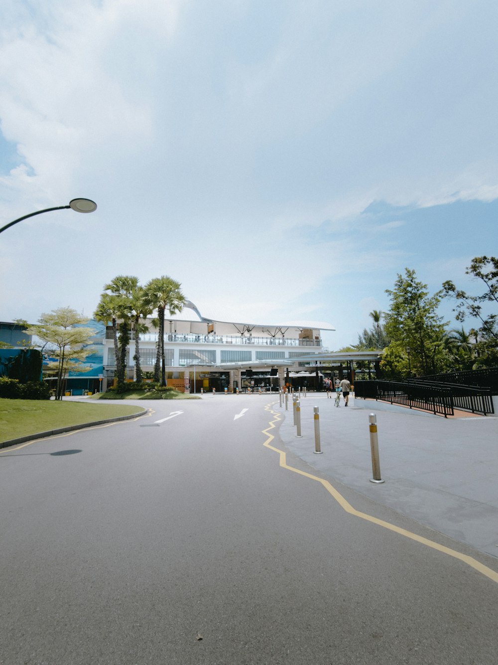 a road with a building in the background