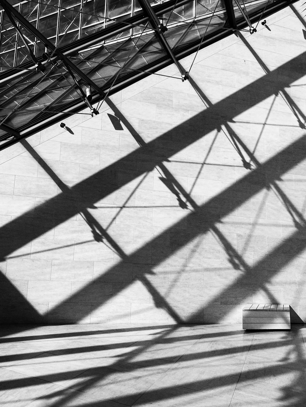 a shadow of a person on a bridge