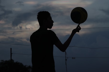 a person holding a frisbee