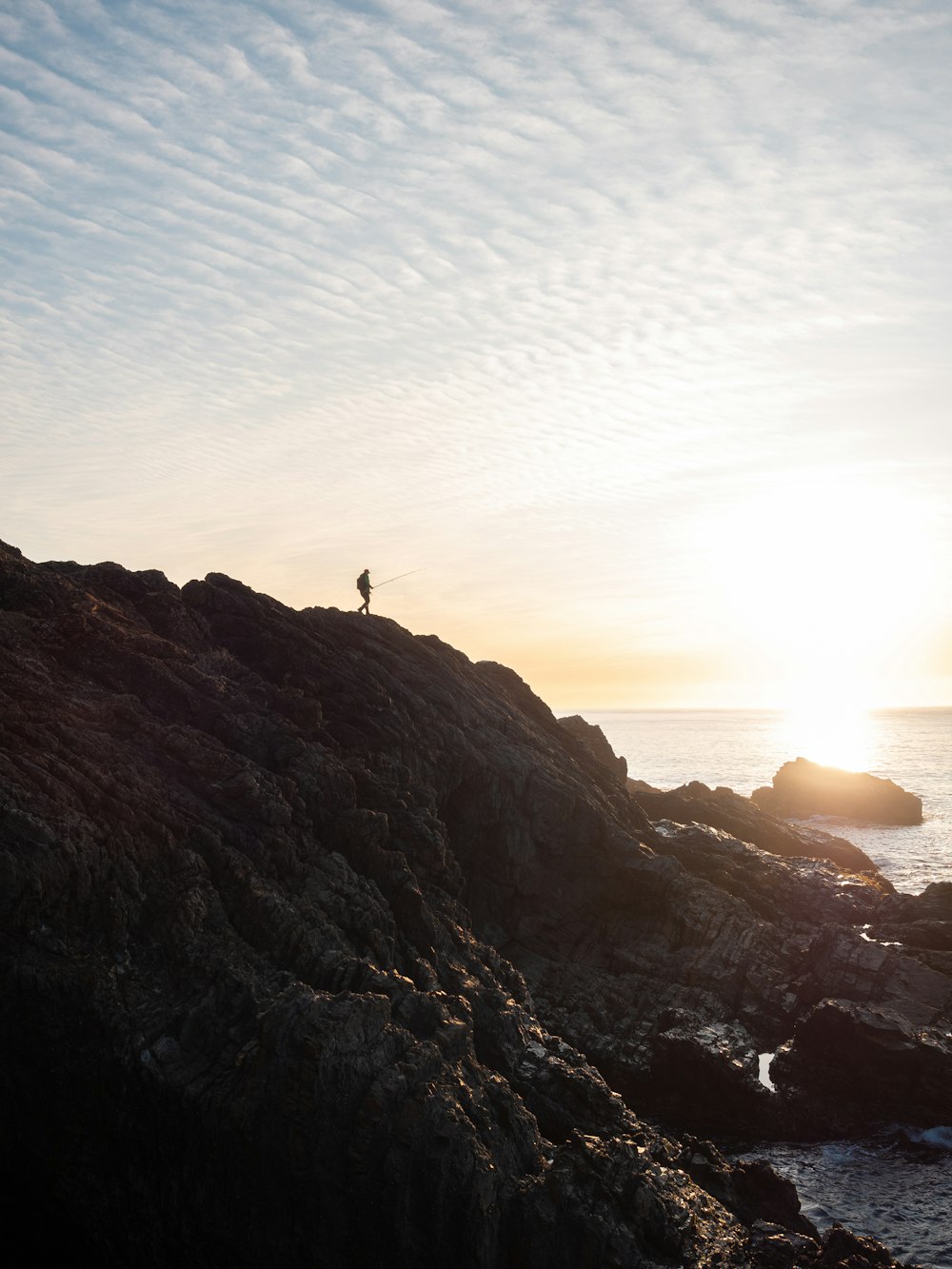 a person standing on a cliff