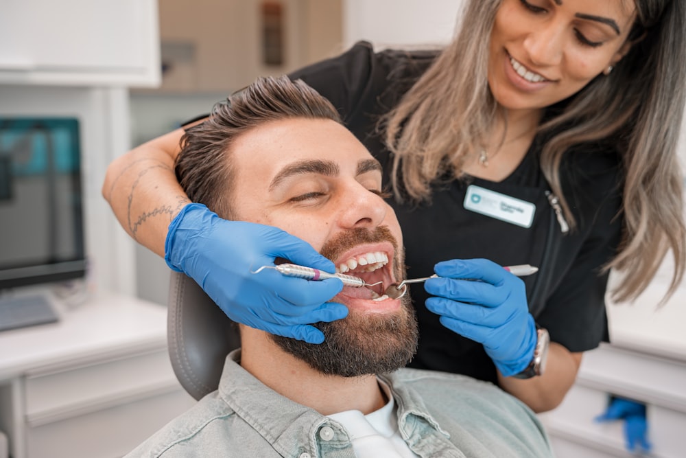 a person brushing a person's teeth