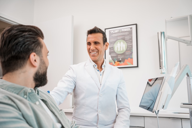 Patient smiling confidently after a successful dental implant procedure in Plano