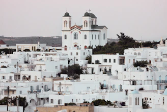 a large white building with a tower