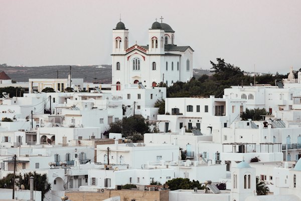 A large white building with a tower — Paros, Greece