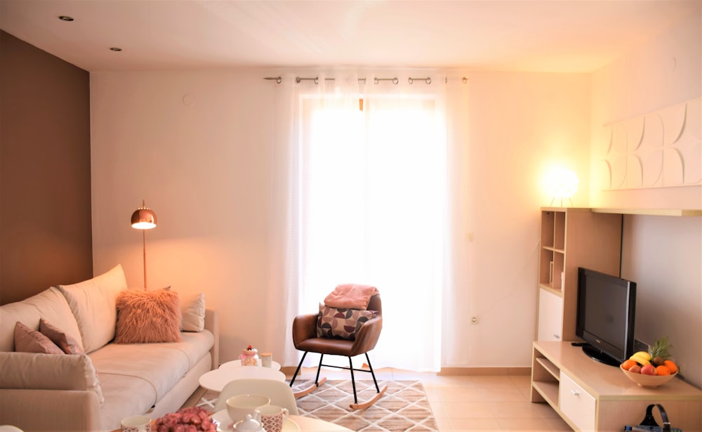 a living room with a white window