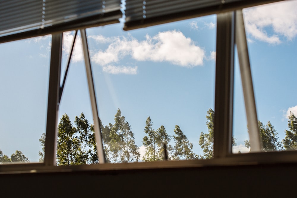 a view of trees through a window