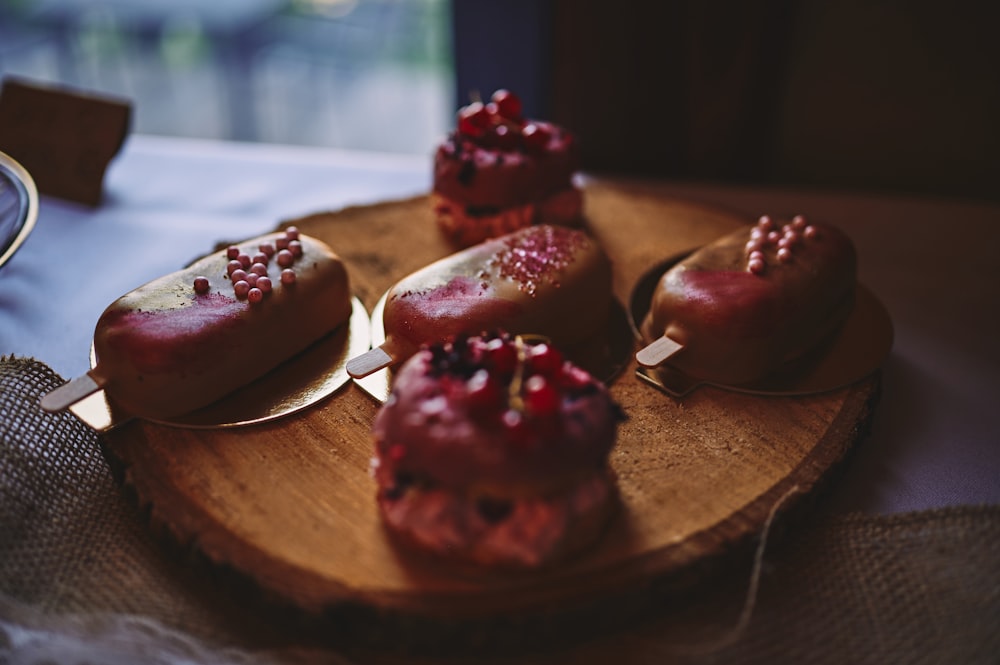 a group of desserts on a wooden surface