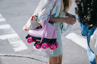 a woman carrying a baby stroller