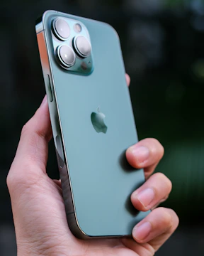 Close-up of hands holding a highly rated budget smartphone with customer rating stars visible.