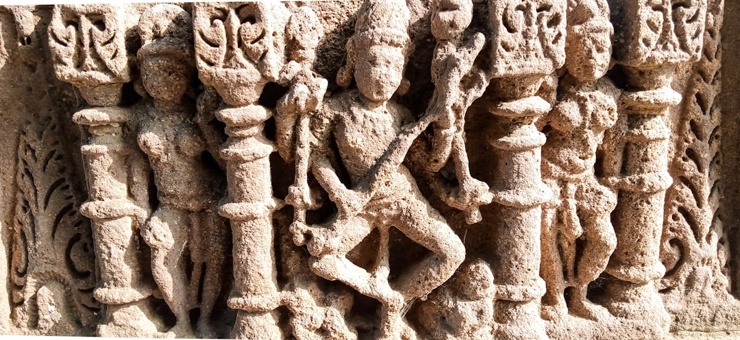 a stone carving of a man and a woman,