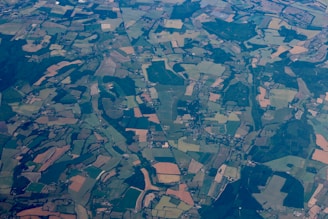 Aerial view of a diverse landscape showing parcels of land ready for acquisition.