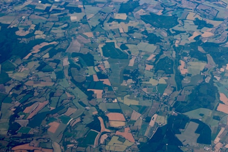Aerial view of a diverse landscape showing parcels of land ready for acquisition.