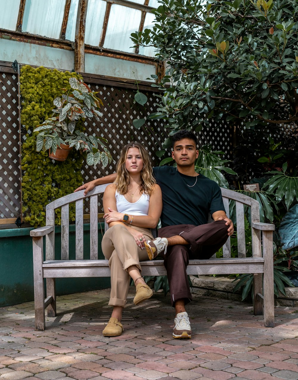 a man and a woman sitting on a bench