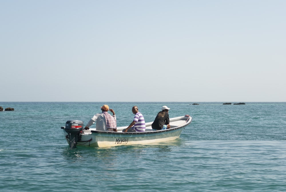 a group of people ride a boat
