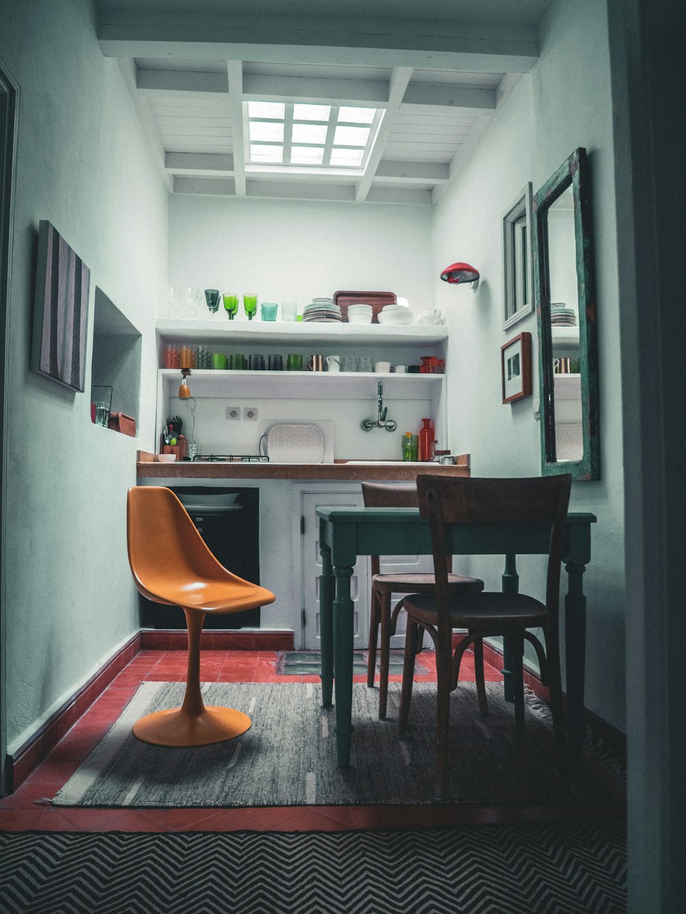 a kitchen with a table and chairs