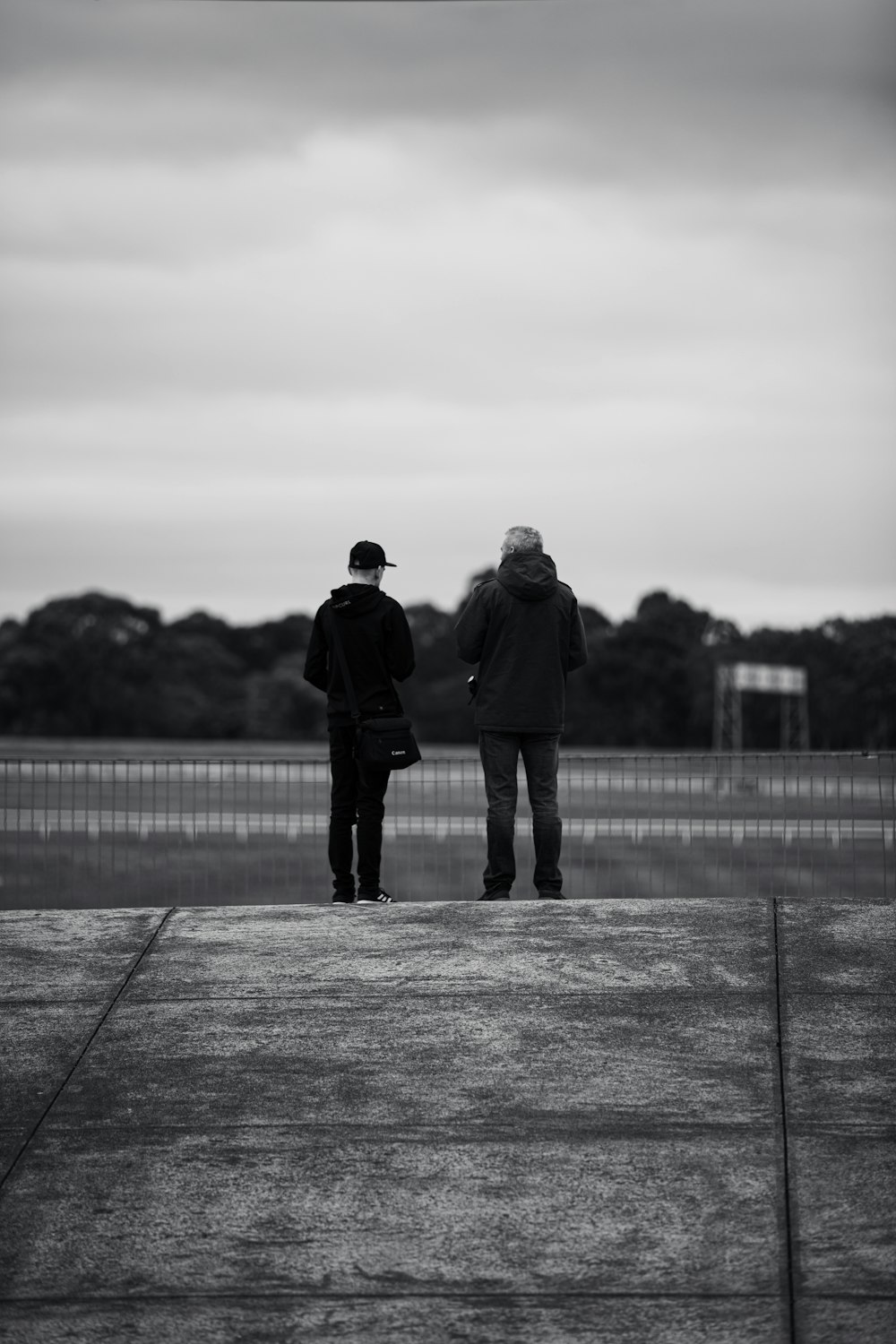 a man and woman standing on a dock