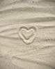 a heart drawn in the sand