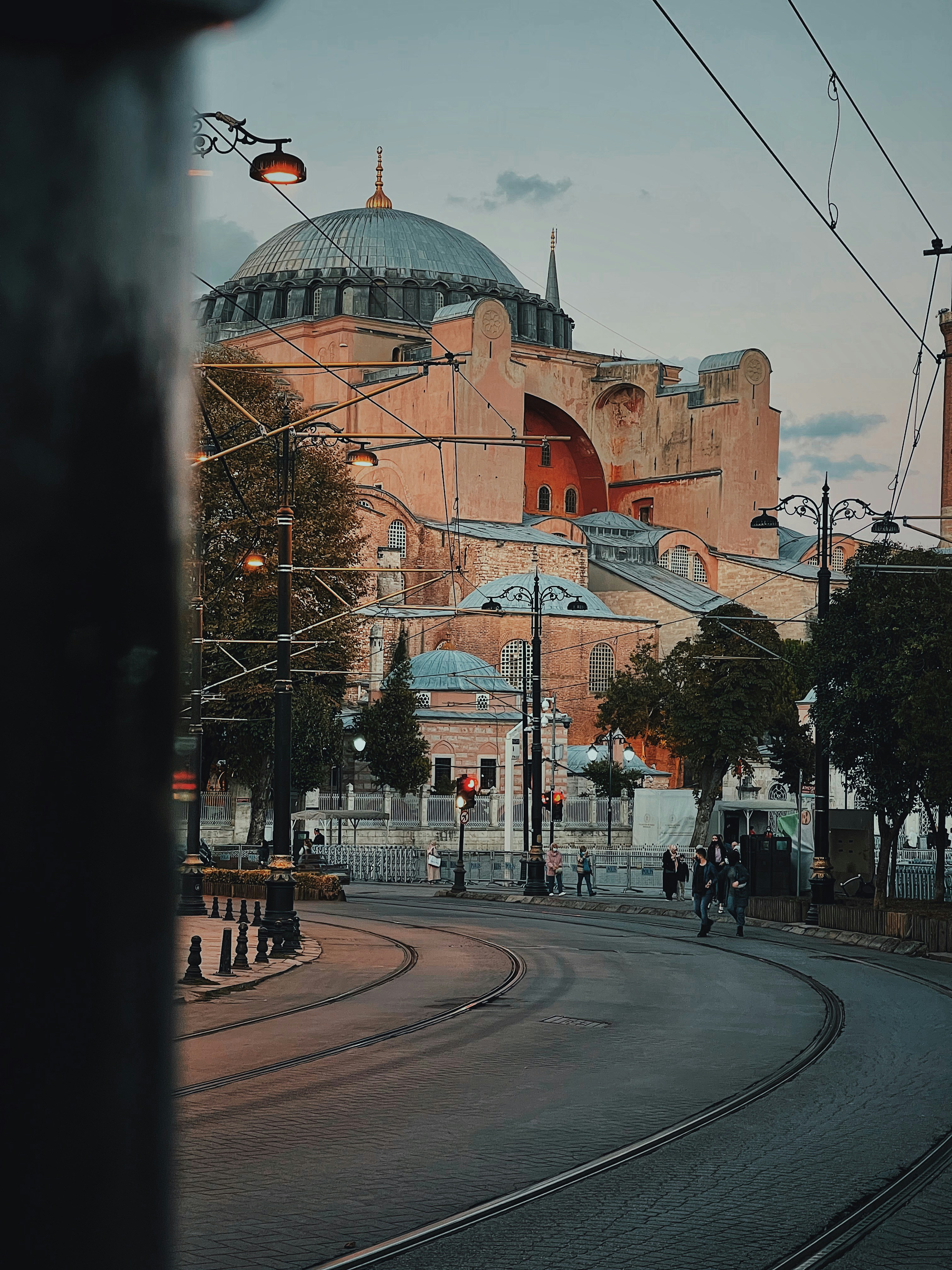 a train track with a domed building in the background