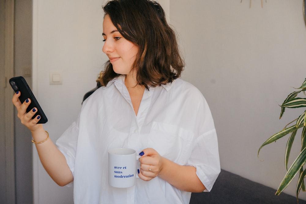 a woman holding a coffee cup