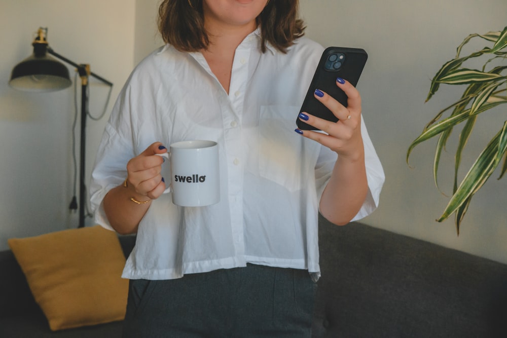a woman holding a coffee mug