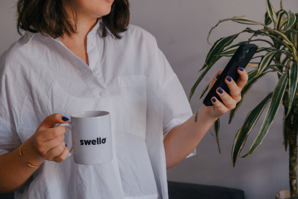 a person holding a coffee cup