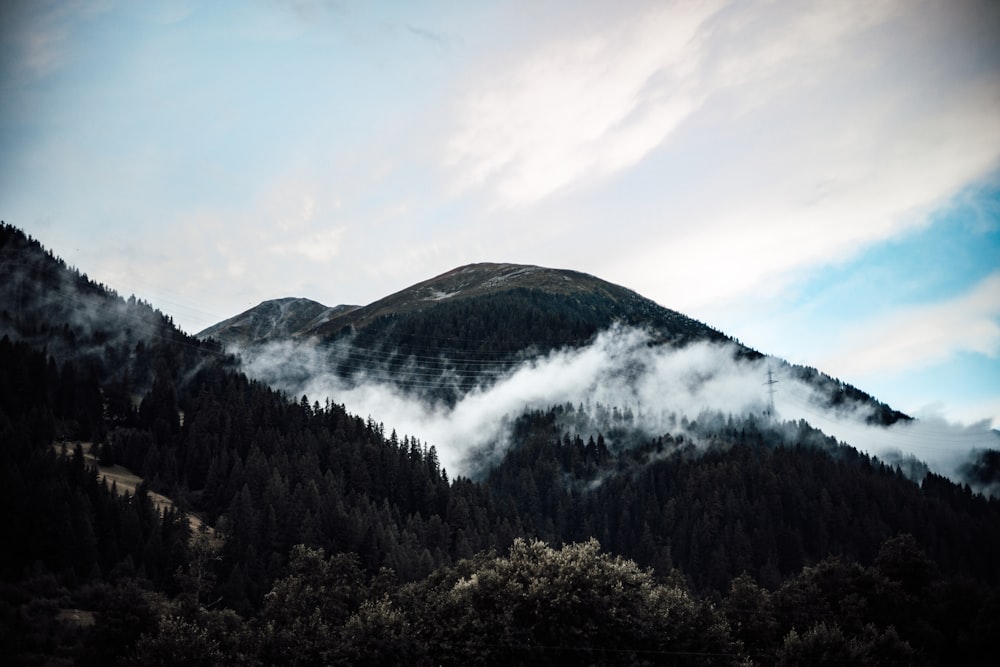 a mountain with clouds