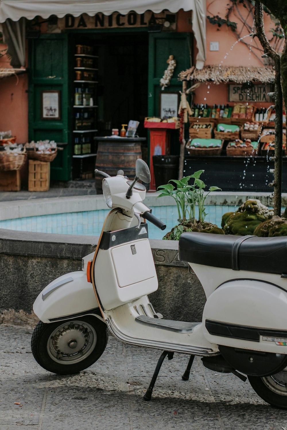 a moped parked outside a store