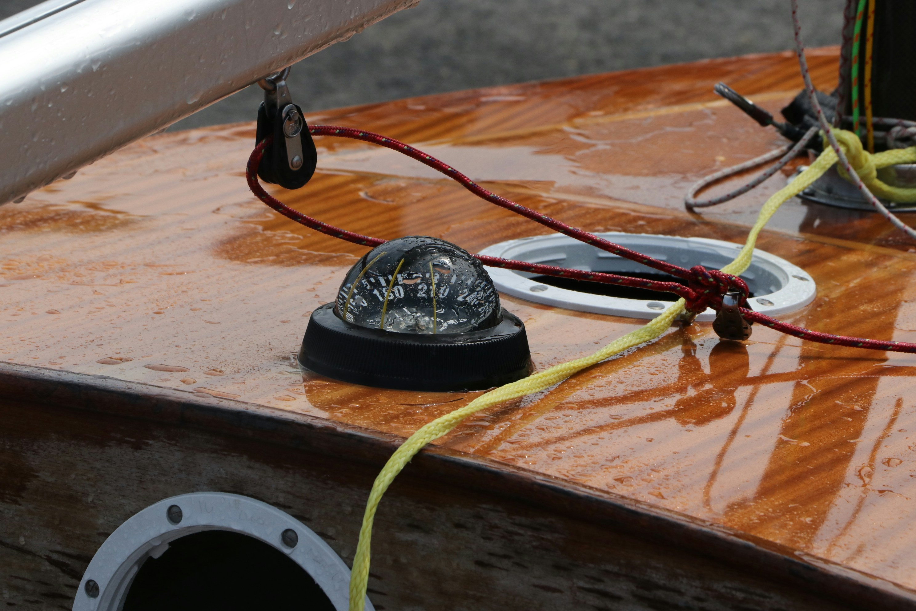 a black and red circular object with wires coming out of it