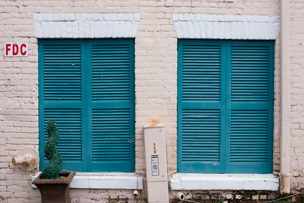 a couple of blue doors on a building