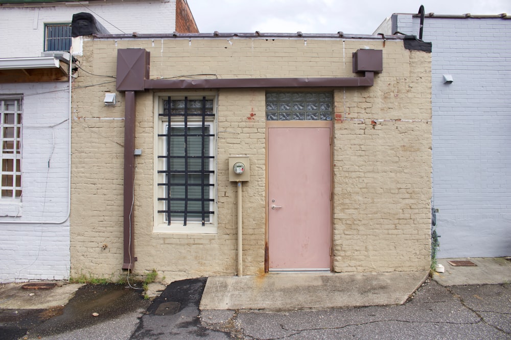 a building with a pink door