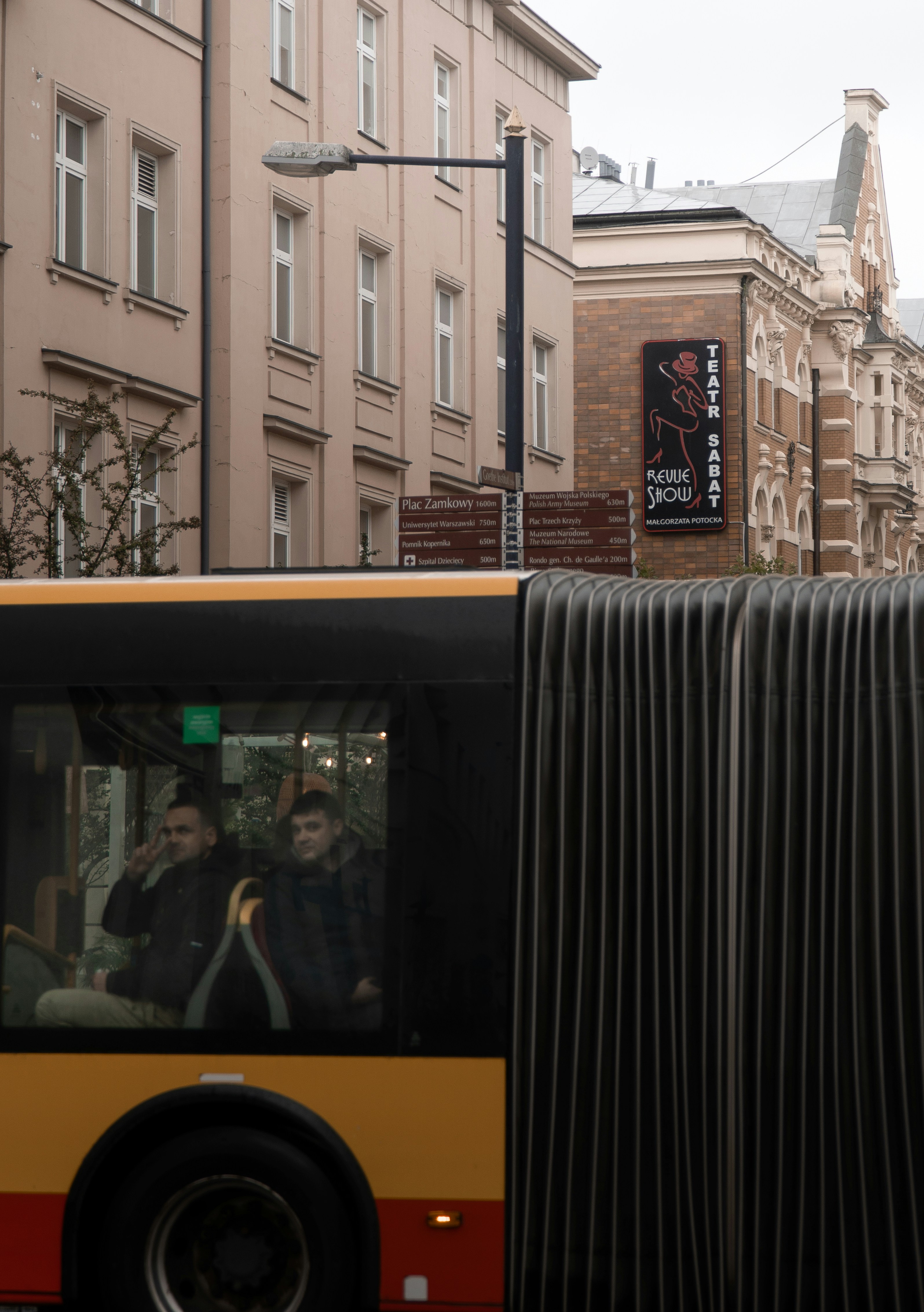 a yellow bus on a street