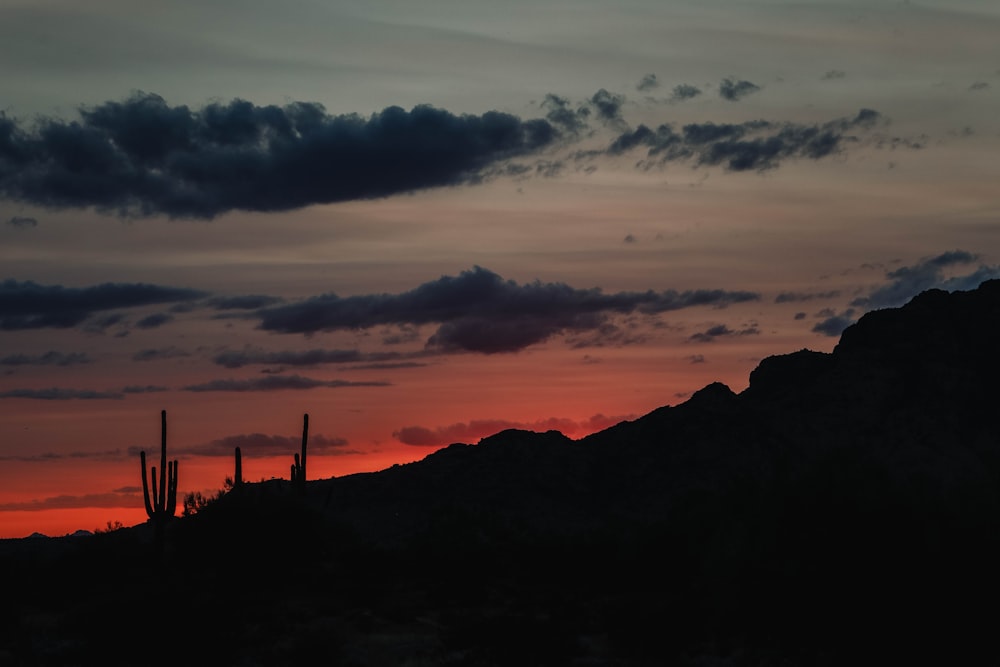 a sunset over a mountain