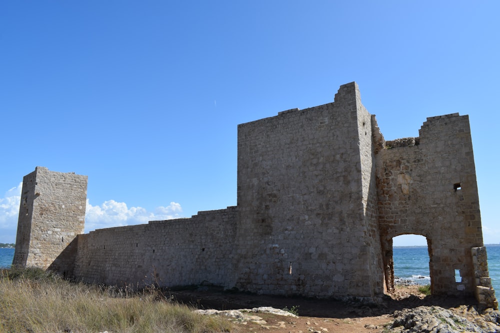 a stone building with a blue sky