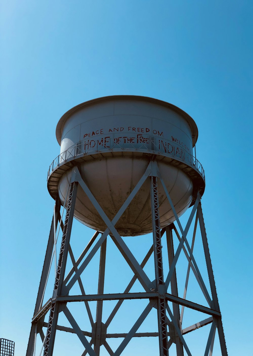a water tower with a blue sky