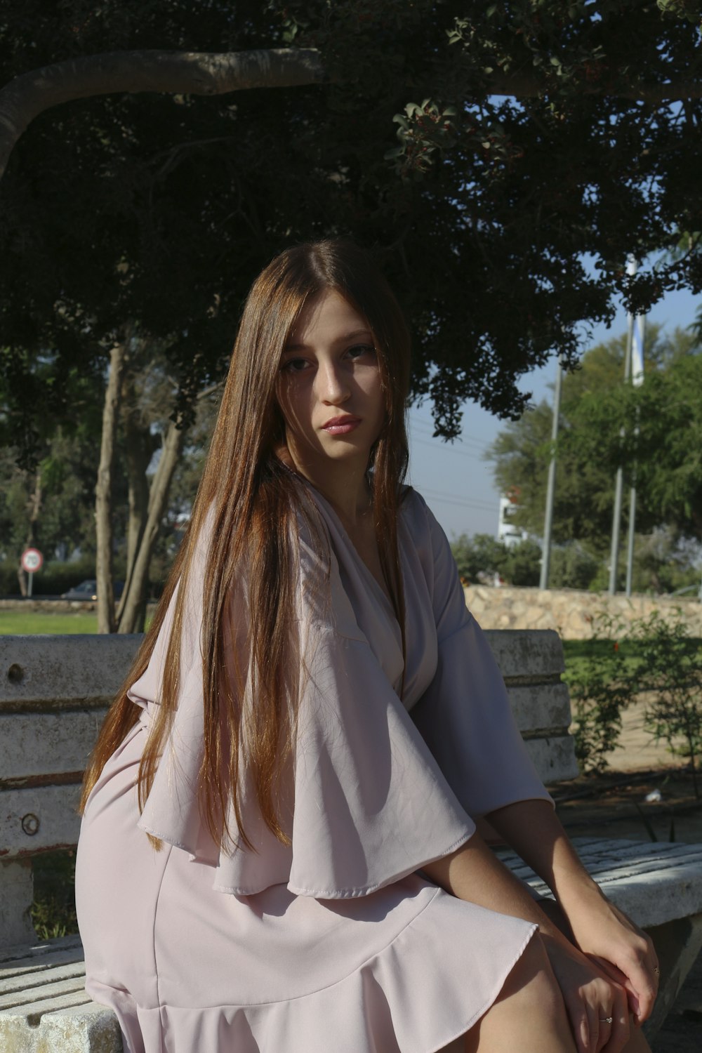 a woman sitting on a bench