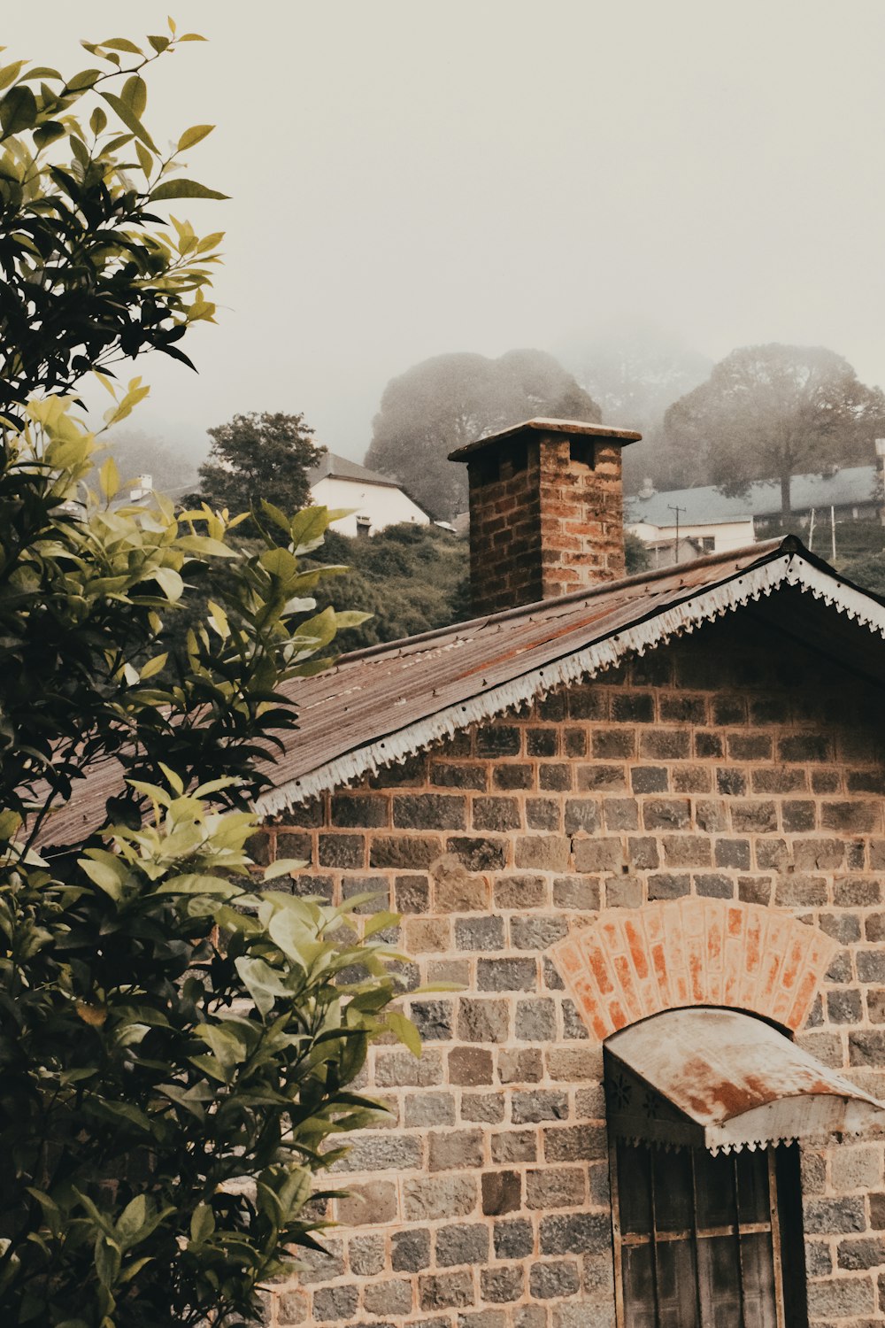 a brick building with a chimney