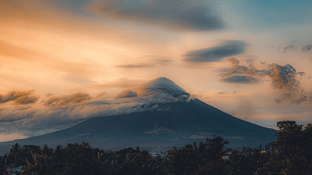 a mountain with a snow capped peak