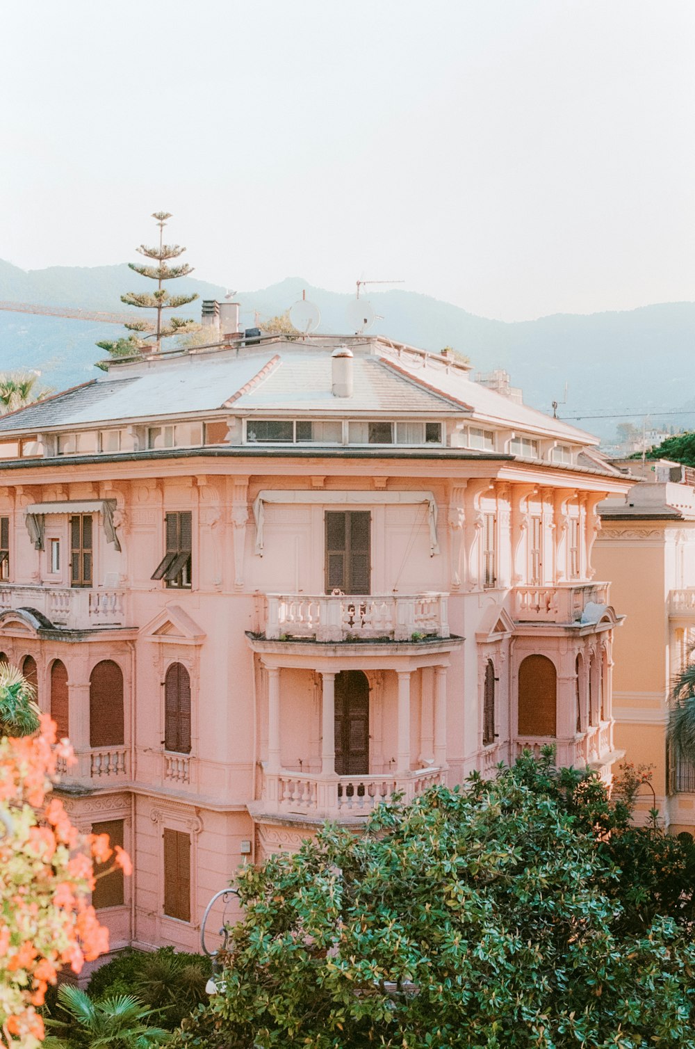 a pink building with a tower