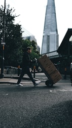Cargo truck loaded with boxes ready for delivery in an urban area.