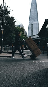 Cargo truck loaded with boxes ready for delivery in an urban area.