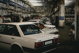 a group of cars parked in a building