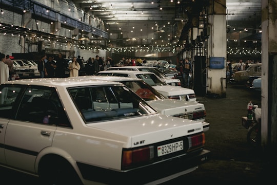 a group of cars parked in a building